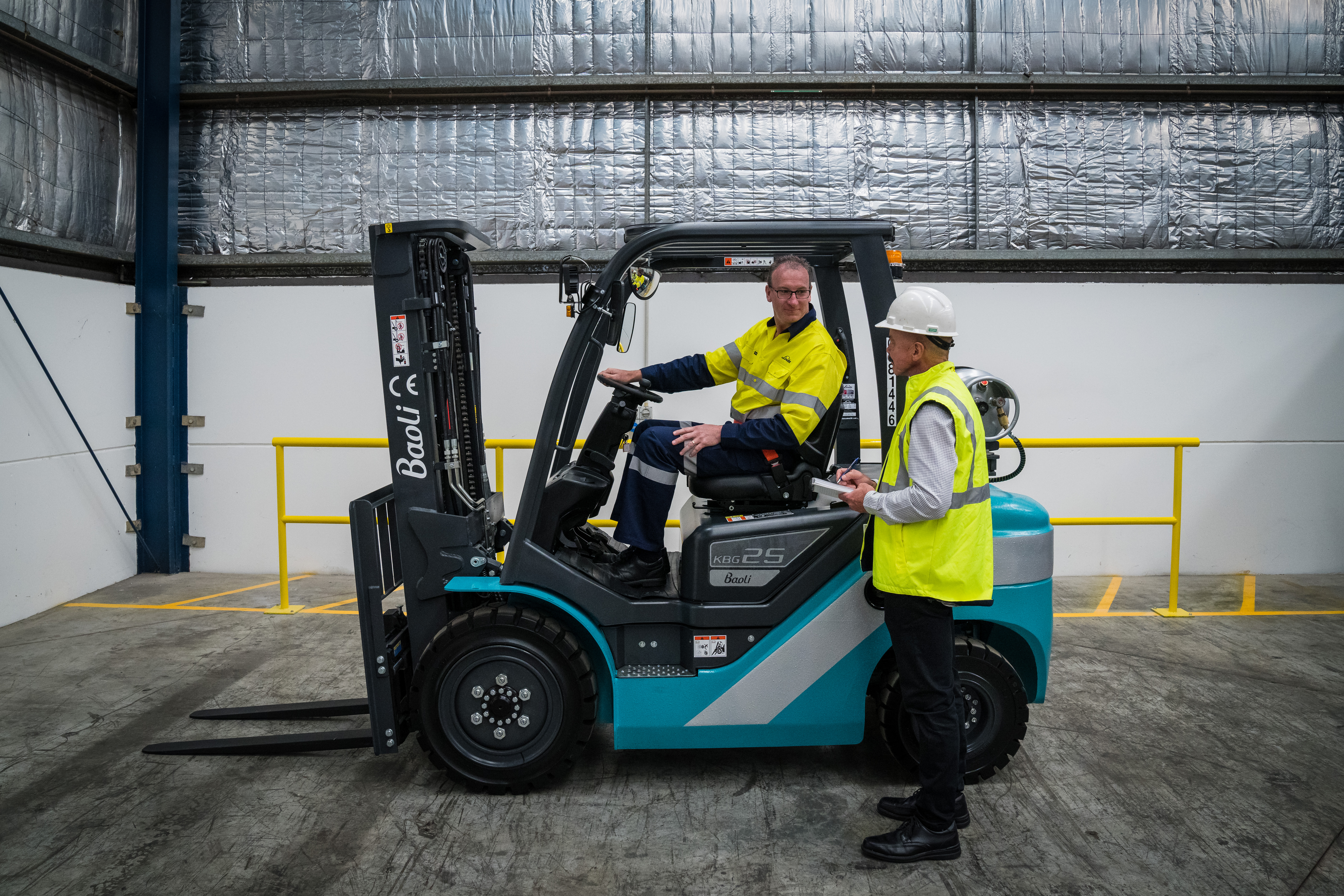 Blue Baoli with protective clothing to stay safe in forklift warehouse